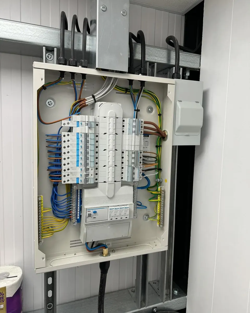Newly fitted consumer unit with neatly dressed cables and labelled circuit breakers