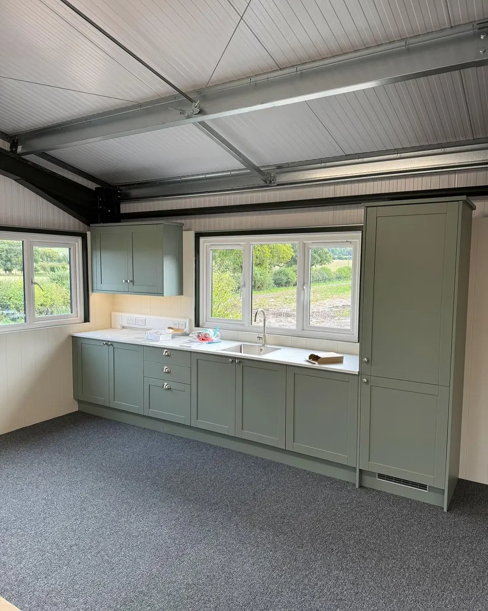 Sage green kitchenette in a commercial unit