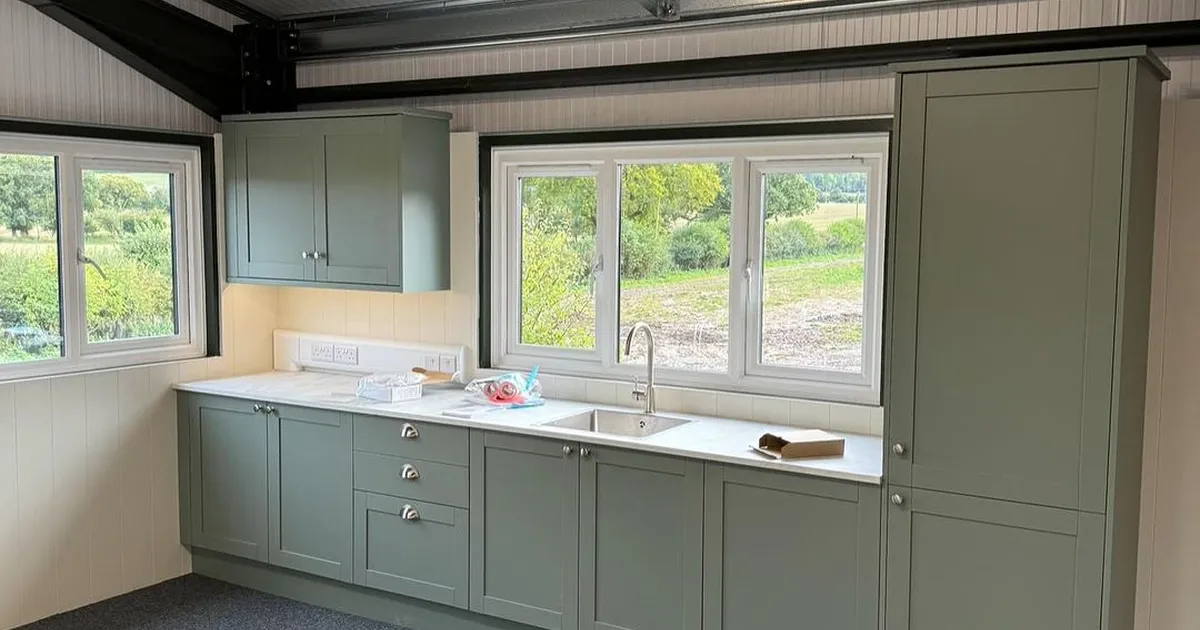 Sage green kitchenette in a commercial unit