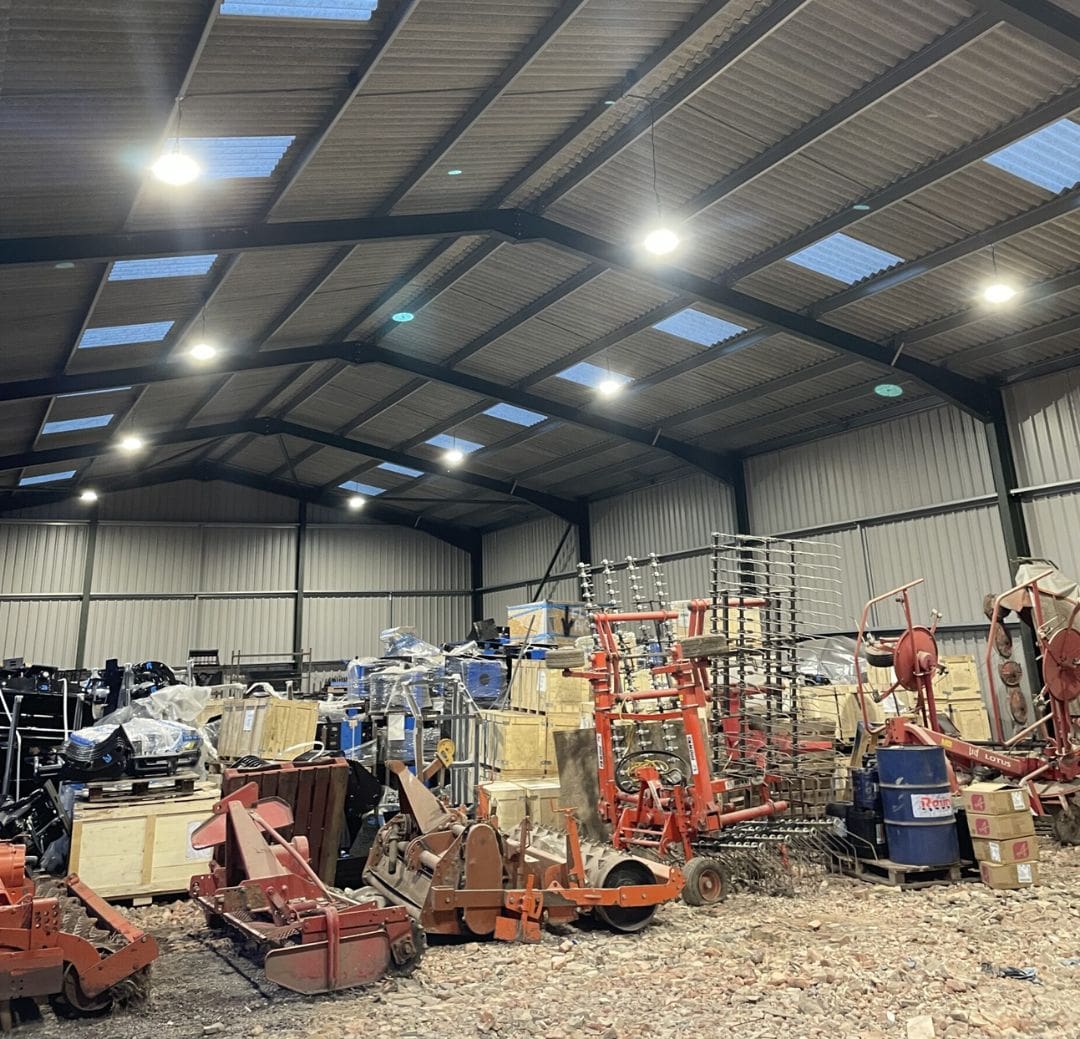 Industrial warehouse with LED lighting and machinery